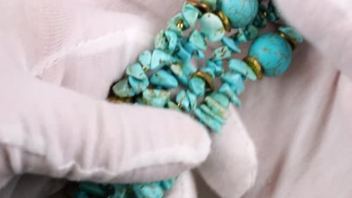 Close up of vintage natural stone beads with golden accents and unique textures.