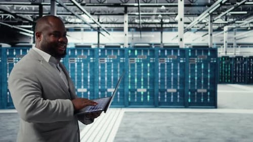 Server Room Engineer Deploying New Builds to Improve Uptime Using Software