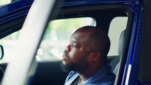 Man Doing Test Drive Examining Car Before Making Purchase