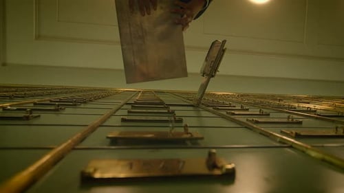 A Man in a Suit Commits a Daring Bank Heist By Opening a Safe and Reaching Into a Bank Vault As