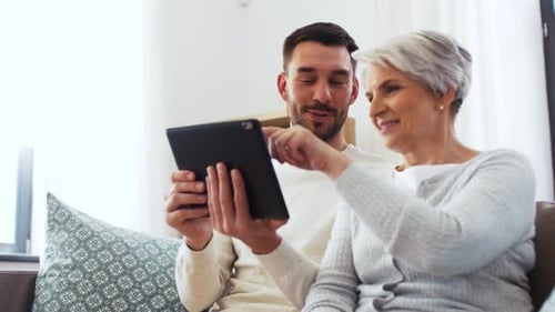Family, Generation and Technology Concept - Happy Smiling Senior Mother and Adult
