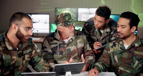 Soldiers Discuss Strategy in Command Center