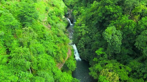 Aerial Top View of Beautiful Aling Aling Waterfall in Nothern Bali Indonesia