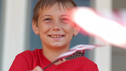 Smiling Boy Waving American Flags Celebrating Holiday