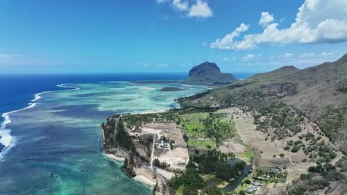 An aerial view of the ocean and mountains