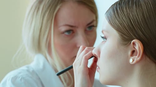 Makeup Artist Work in Her Beauty Studio Portrait of Woman Applying By Professional Make Up Master