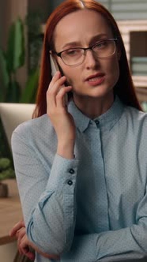 Angry Caucasian Ginger Business Woman Arguing on Mobile Phone Inside Office Irritated Female in