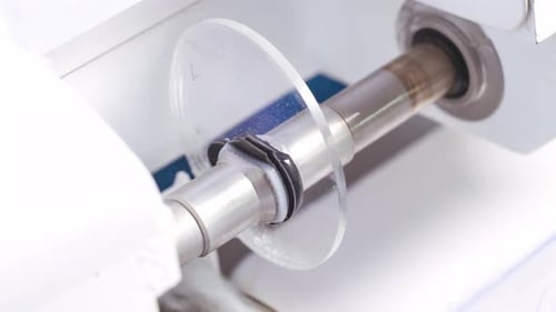 Lens Being Crafted on Machine for Eyeglasses