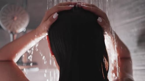 Woman Washing Long Hair in Shower