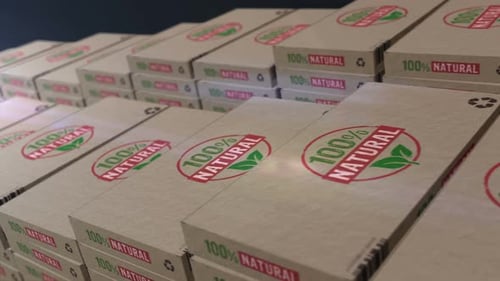 Tracking Shot of 100% Natural Cardboard Product Boxes