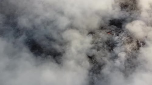 Aerial smoke release from fire burning