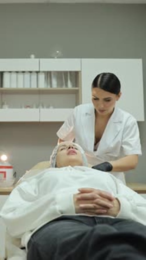 Professional Cosmetologist Performing Neck Mesotherapy Treatment