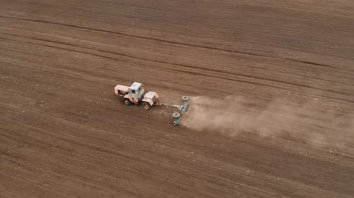 Tractor Working a Rural Field, Aerial Shot