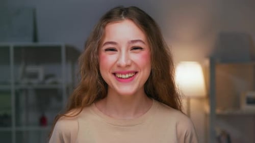 Happy Portrait of Young Laughing Woman Looking at Camera with Smiling Face