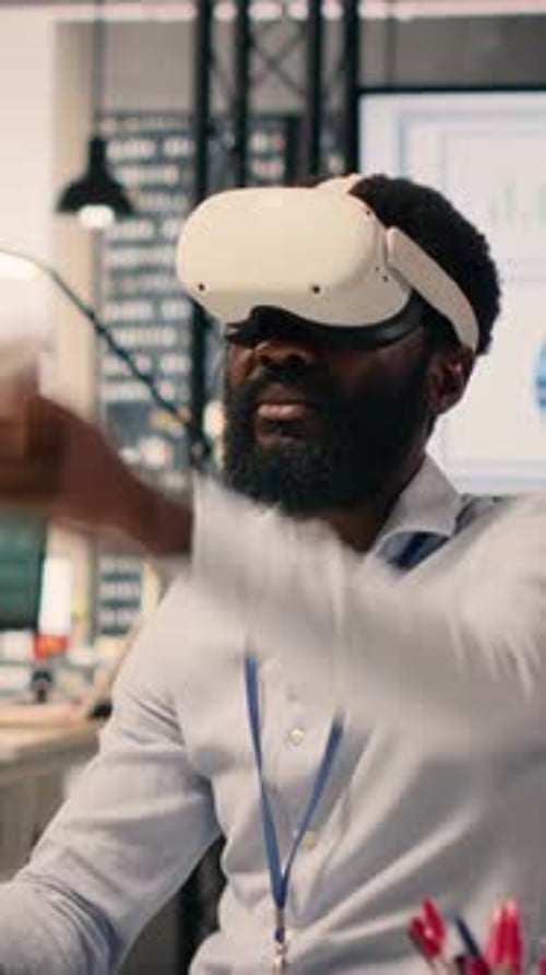 Vertical Video African American Man Wearing VR Headset Goggles in a Modern Office