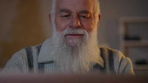 Closeup an Elderly Bearded Man with Positive Emotions on His Face