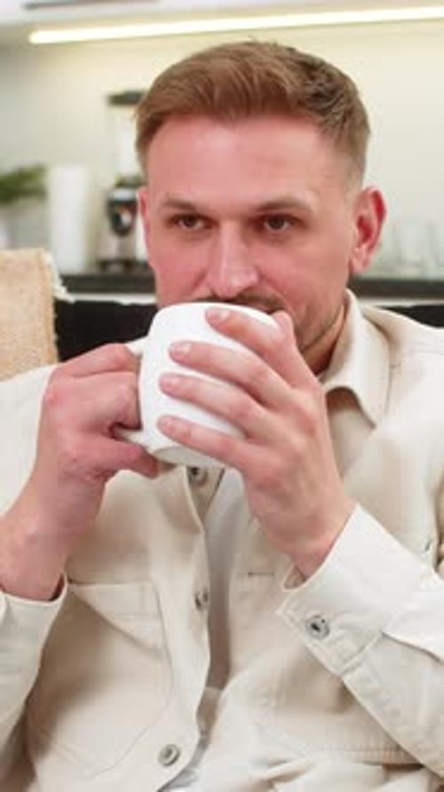 Man Enjoying a Cup of Coffee at Home