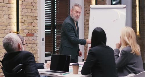 Executive Giving a Technology Presentation to Team