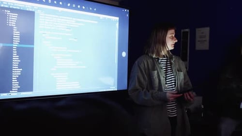 Young Woman Presents Code at Tech Conference