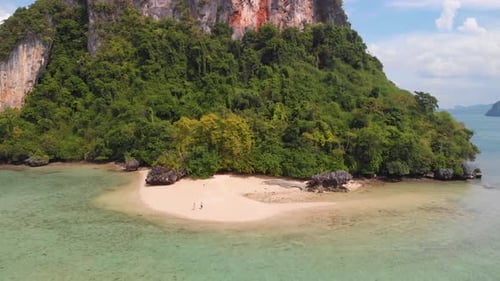Aerial Drone View Rai Island Beach in Thailand with a Secluded Couple Walking Down the Beach, near H