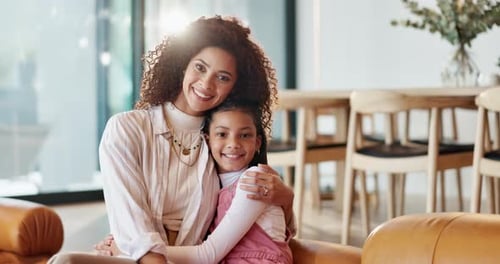Smiling Woman and Child Embrace in Bright Home