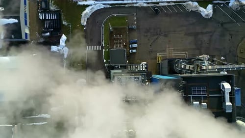 Aerial View of Industrial Plant with Smoke