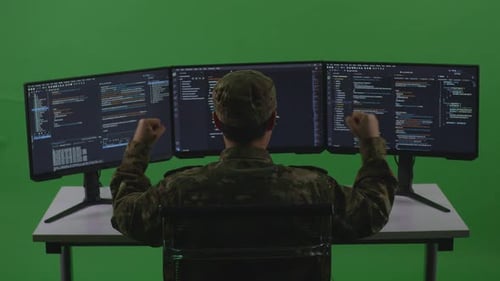 Man Soldier Developer Celebrating While Write Code With Multiple Screens In Green Screen