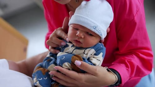 Sweet Infant Held Gently Indoors By Adult