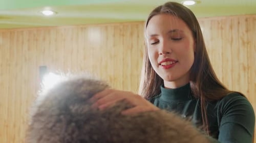 Woman Rescues Companion Joyful Woman Comforts Furry Friend Happy Woman Soothing Fluffy Rescue on
