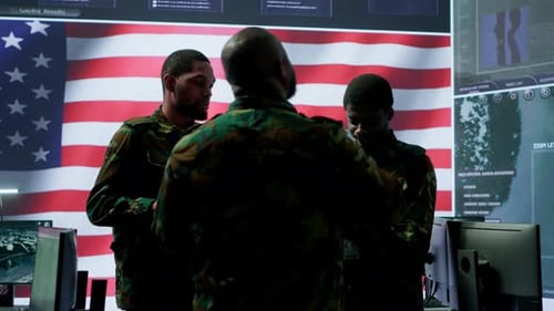 American Army Officers in High Tech Command Center Monitor Cybersecurity Threats