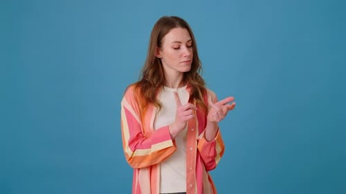 Female in Bright Shirt Counts on Fingers Number of Wishes