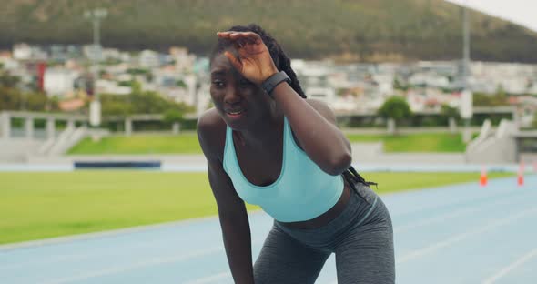Tired athlete checking smartwatch, timing running pace, stamina ...