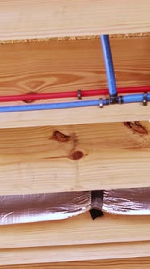 Pipes inside a wall of a building