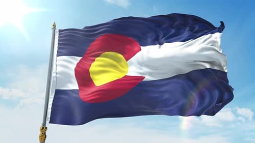 Realistic Colorado Flag Waving Against Bright Blue Sky