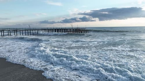 Top View of the Central Beach Drone Rotation Around Its Descent to the Beach