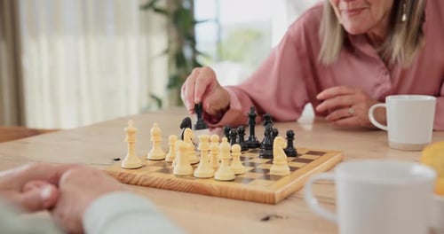 Smiling Senior Woman Playing Chess Game