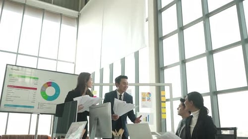 White collar workers are meeting at modern office.