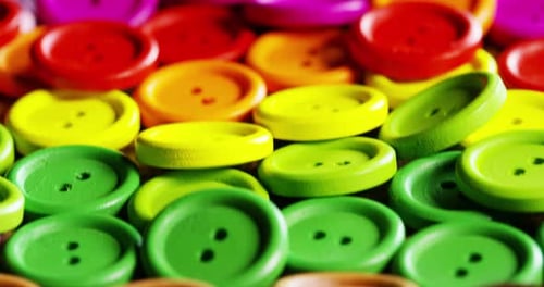 fall in slow motion buttons colorful couture, buttons of all high-fashion colors to sew on clothin