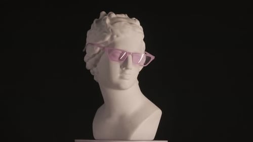 Closeup Shot Ancient Marble Bust Statue of Roman Era Woman in Pink Glasses Spinning Round on a