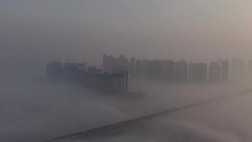 A new town in the haze where the sun rises.