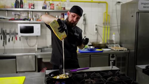 Chef Preparing Delicious Meal in Commercial Kitchen