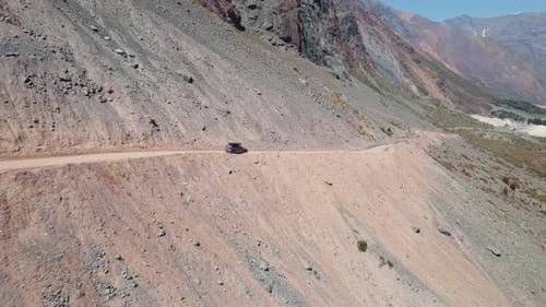 Car With Rooftop Tent Driving On An Off-road Mountain Pass In Andes, Chile. - aerial