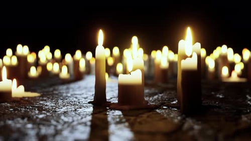 Flickering Candles in Darkness for Spiritual Remembrance