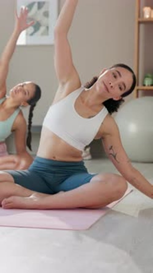 Women, stretching and fitness with yoga at gym for energy balance, posture progress