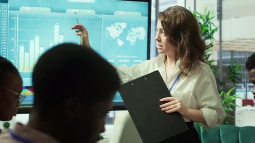 Business Associates Reviewing Key Performance Indicators Within the Enterprise