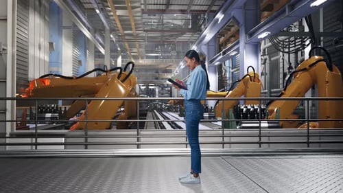 Asia Professional Female Works On Her Tablet With Robotic Arms