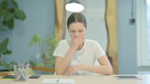 Coughing Sick Young Woman Sitting in Office