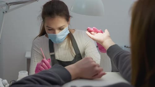 Woman Getting Manicure at Nail Salon