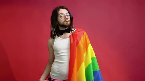 Person with Pride Flag Posing in Studio