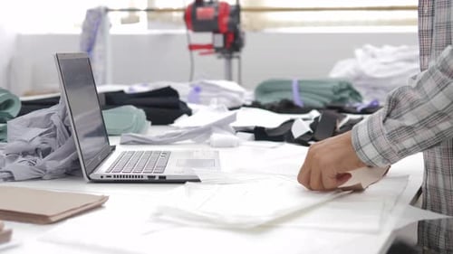 Male Fashion Designer Searching of Inspiration Makes Fashion Sketch in Studio Atelier Has a
